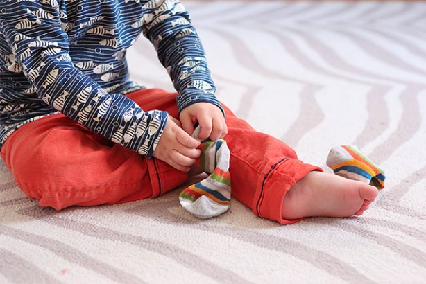 toddler-putting-on-socks-wearing-winter-water-factory