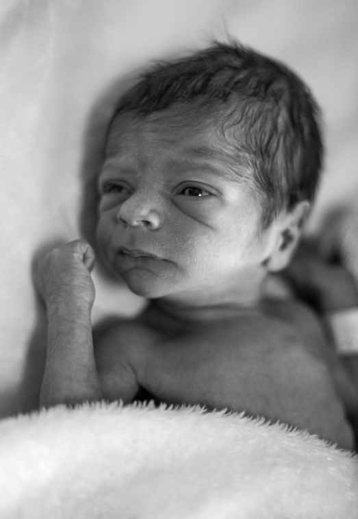 grayscale photo of newborn baby